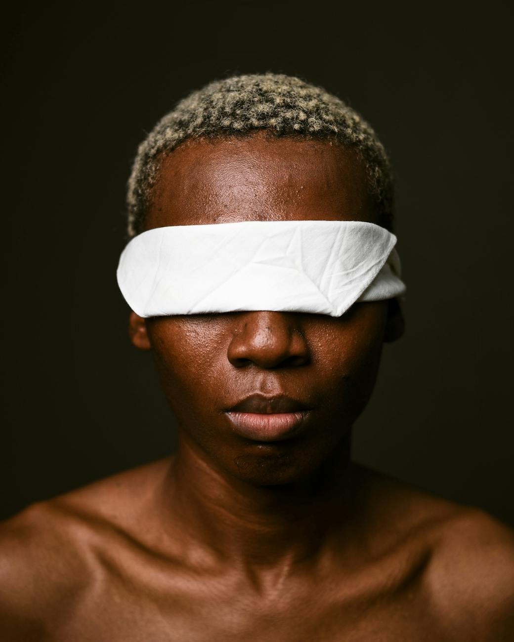 powerful portrait of blindfolded individual